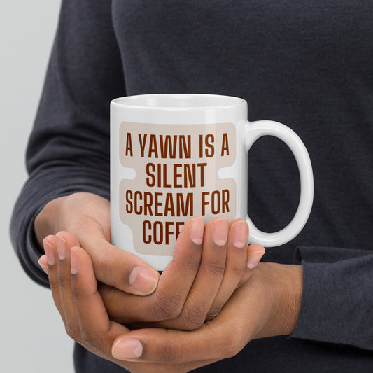 White glossy mug "A Yawn Is A Silent Scream For Coffee"